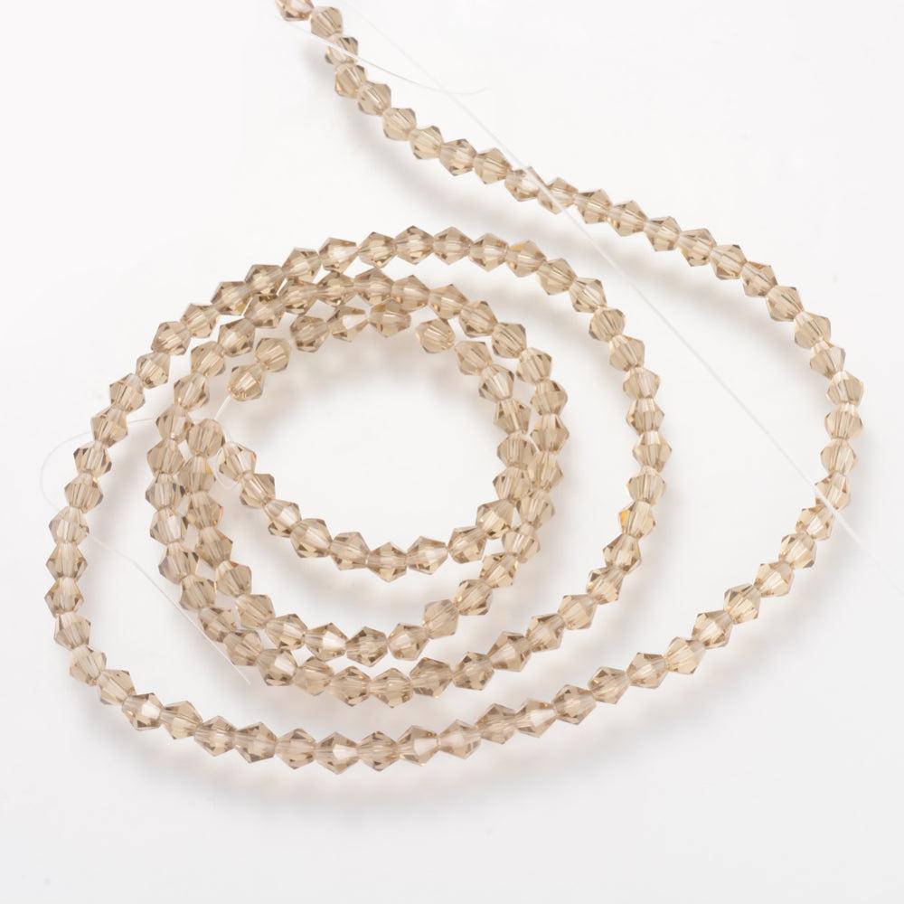 Glaskralen Facet Bicone Beige 6mm - ± 23 stuks-Kralen-Kraaltjes van Renate