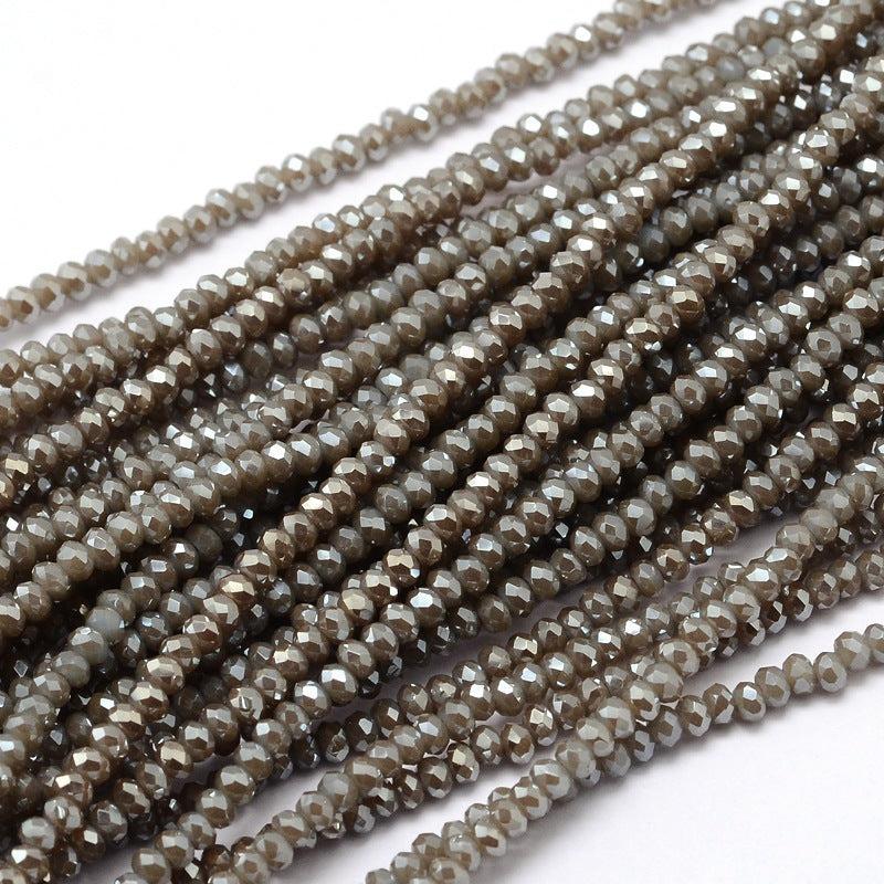 Glaskralen Rondel Kaki 3x2mm - per streng (± 140 stuks)