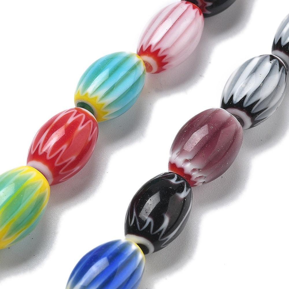 Glaskralen millefiori strepen gekleurd Rice 11mm - per stuk-Kralen-Kraaltjes van Renate