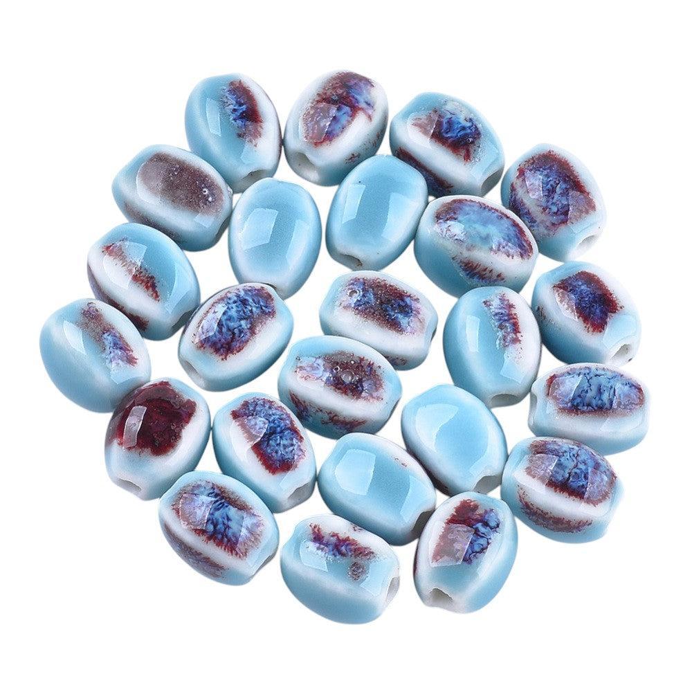 Kraal porselein ovaal blauw gestreept 12mm - per stuk-Kralen-Kraaltjes van Renate