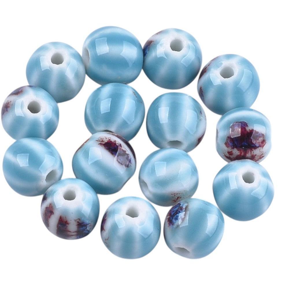 Kraal porselein rond blauw gestreept 12mm - per stuk-Kralen-Kraaltjes van Renate