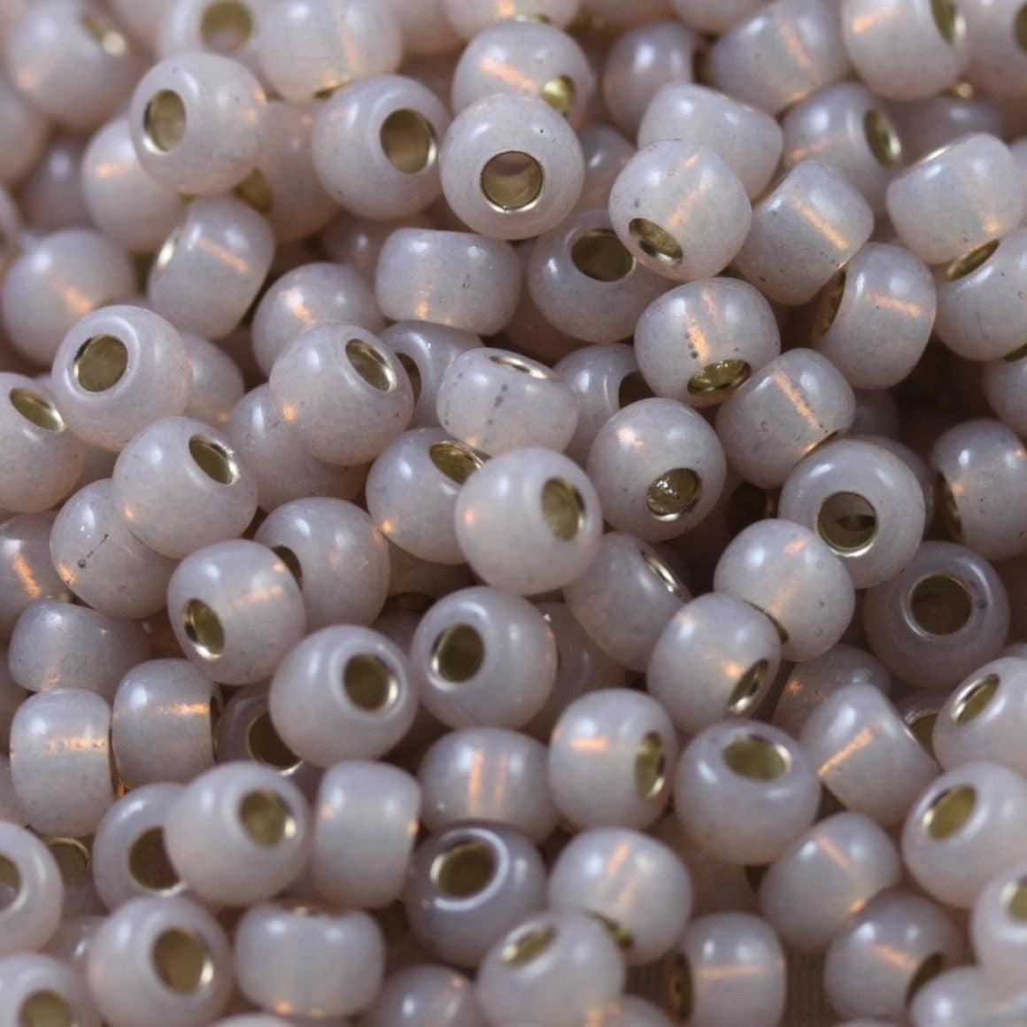 Miyuki rocailles 6/0 (4mm) Dyed smoky light rose silverlined 6-579-Kralen-Kraaltjes van Renate