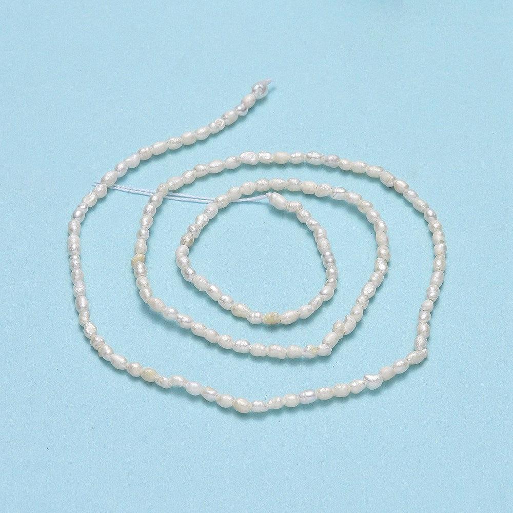 Zoetwaterparel dun lang 4-5mm wit - per stuk-Kralen-Kraaltjes van Renate