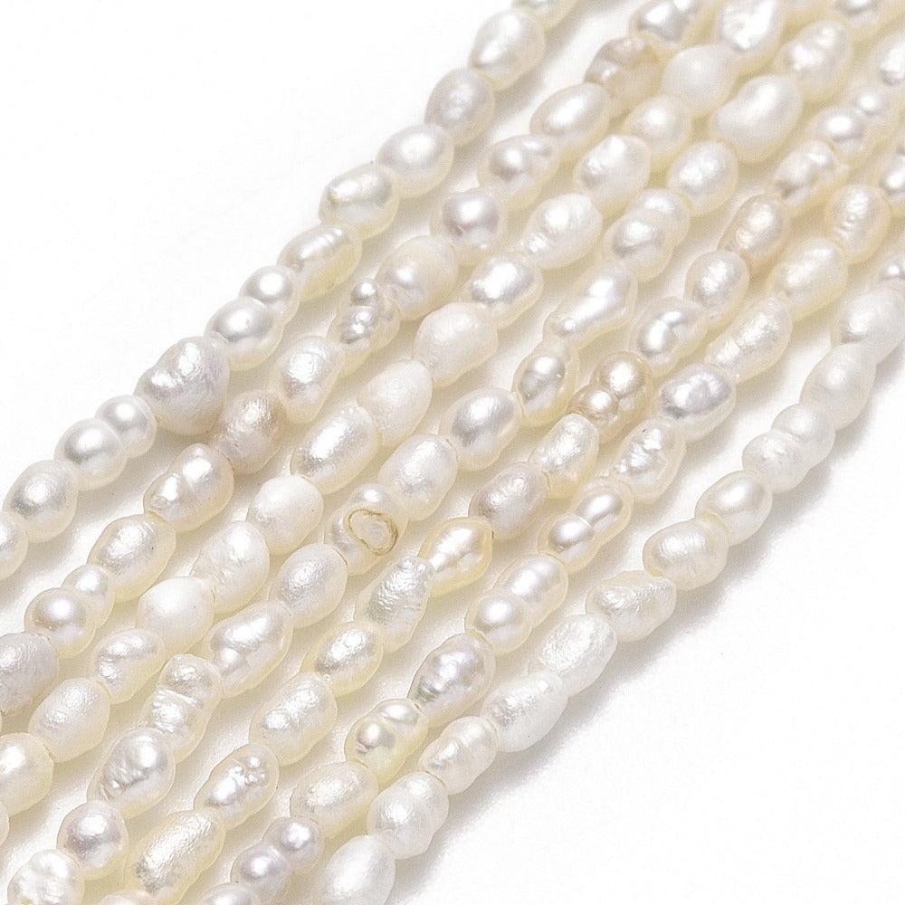 Zoetwaterparel dun lang 4-5mm wit - per stuk-Kralen-Kraaltjes van Renate